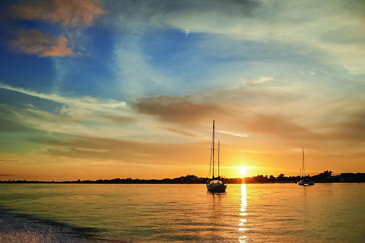 sailing belize coast catamaran sunset