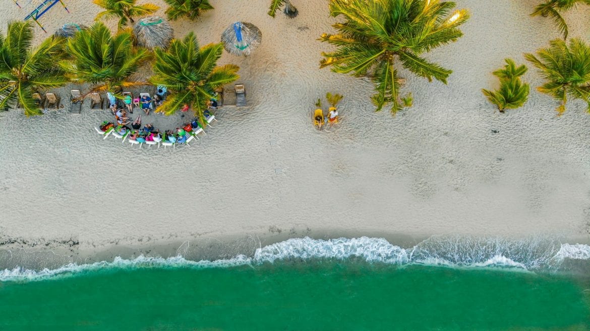 placencia beach couple colorful tipsy