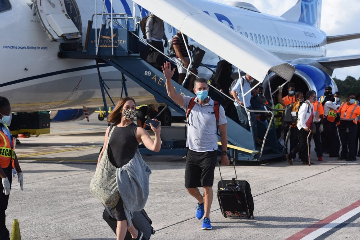 united entry pcr Belize Denver face masks tarmac airport