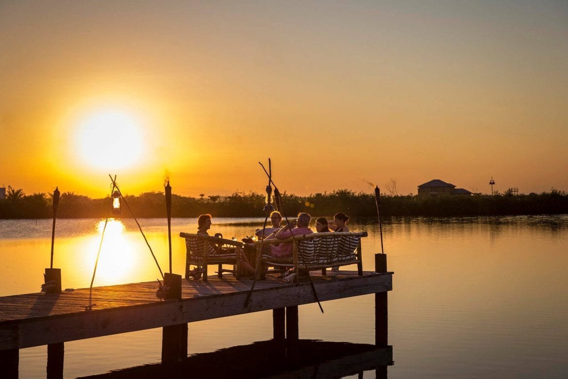 sunset placencia lagoon turtle inn