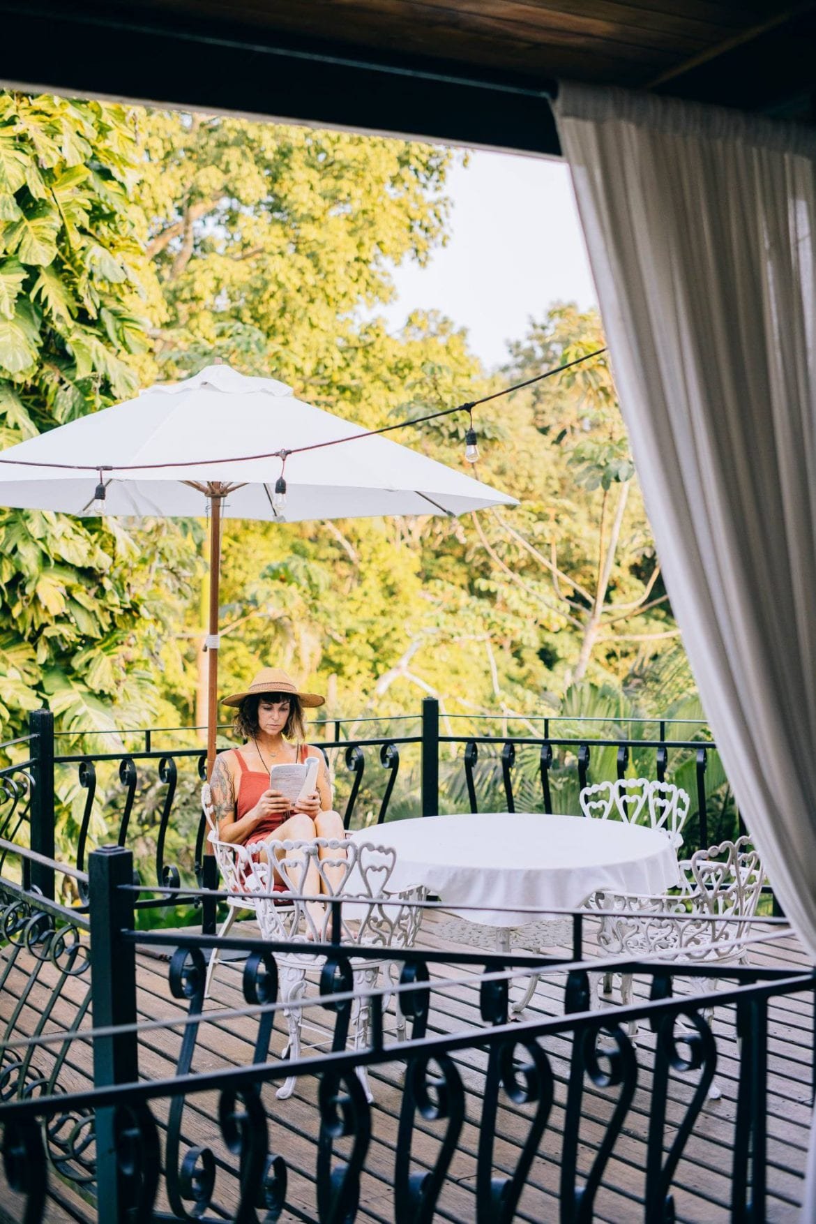 reading book porch San Ignacio resort hotel