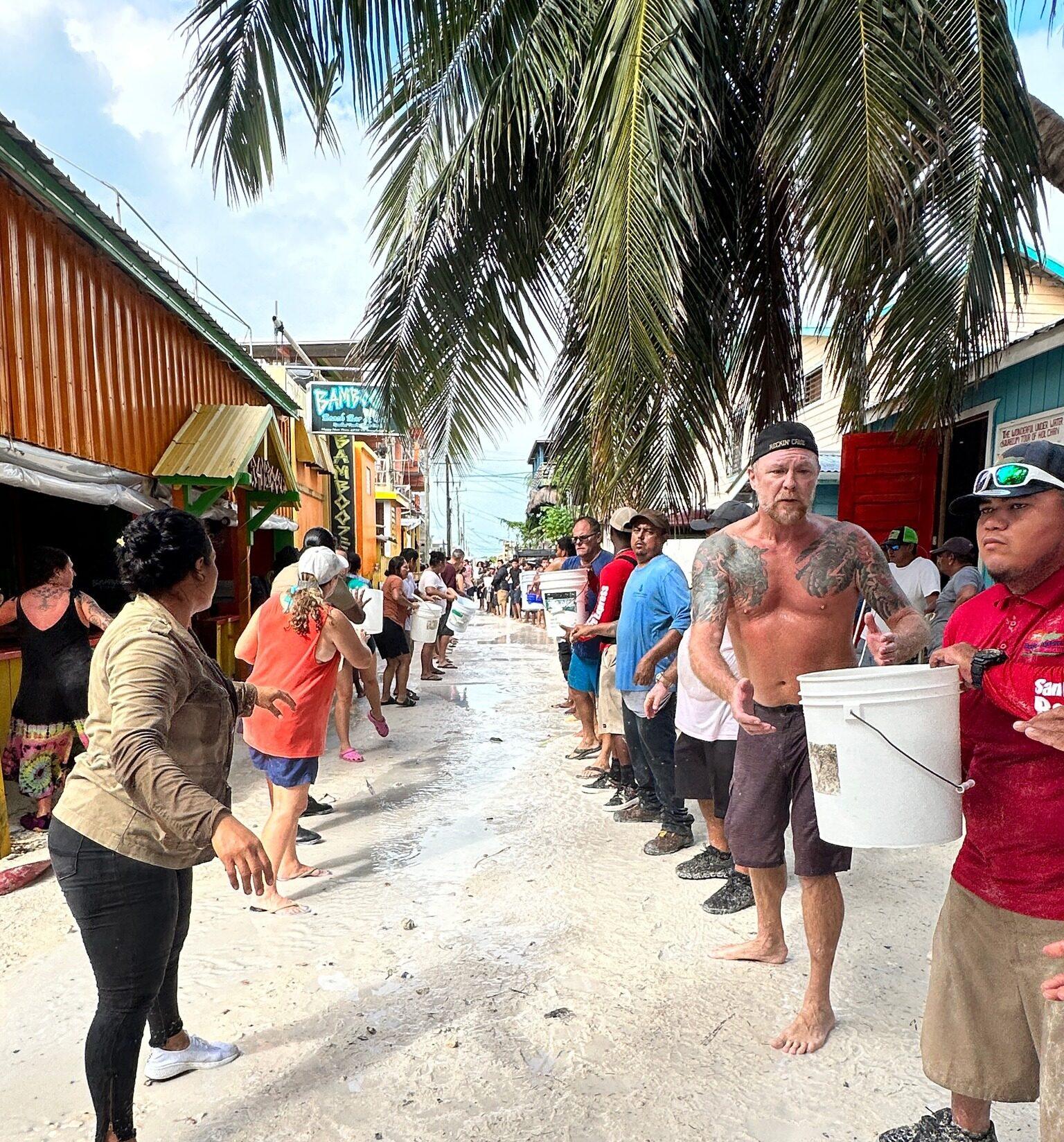 SB-bucket-brigade-credit-go-slow-caye-caulker