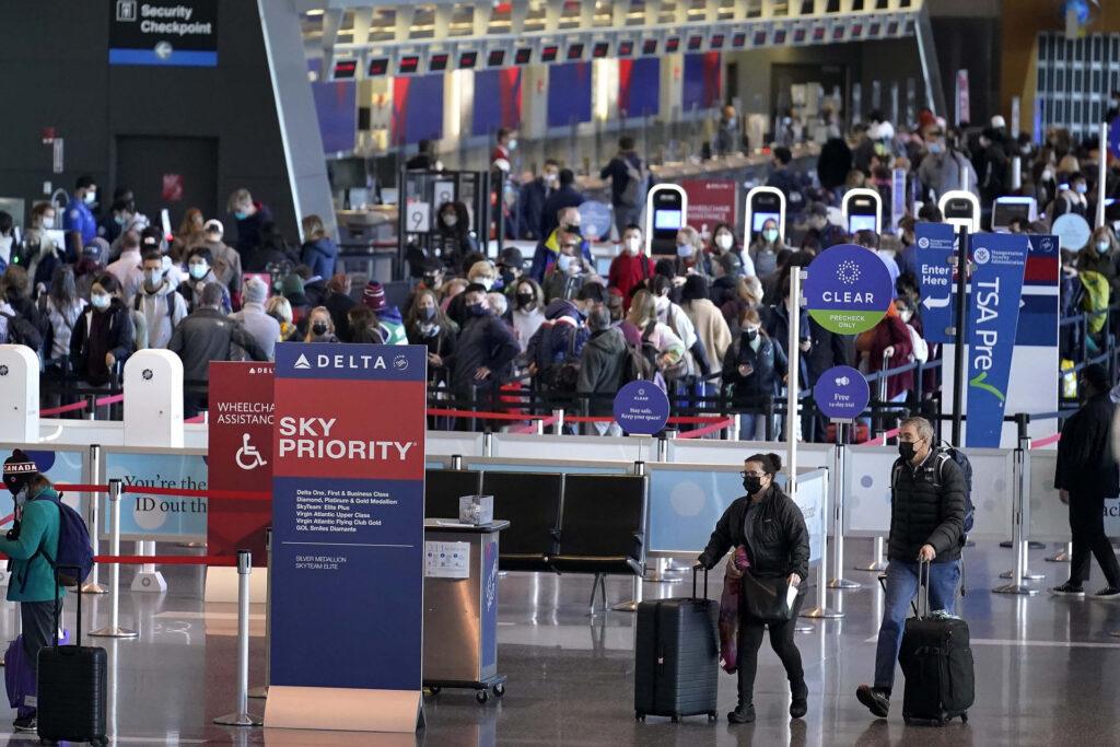 Travelers-enter-security-checkpoints-at-Logan-International-Airport-in-Boston-on-Nov.-24-the-day-before-Thanksgiving.-Steven-SenneAP-Photo