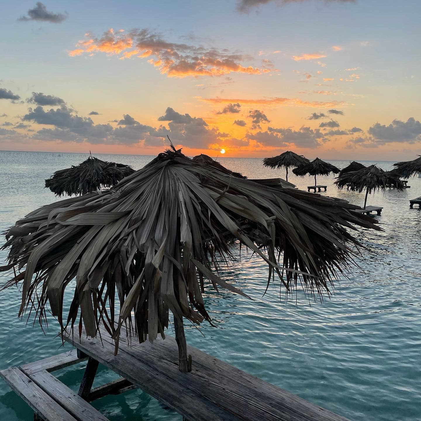 blue-bayou-sunset-overwater-palapa-bar