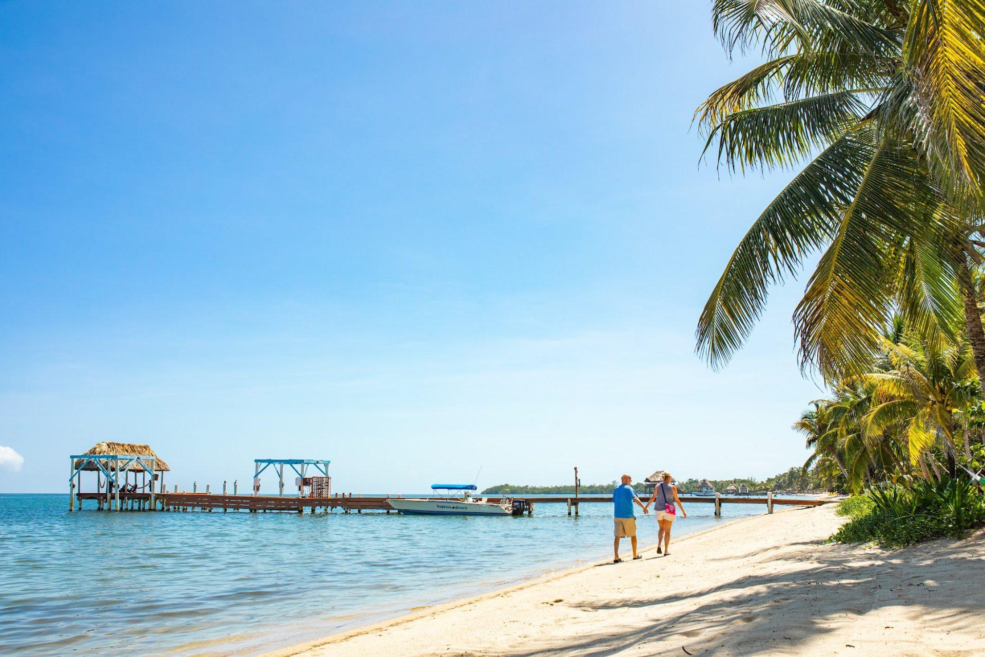 hamanasi-resort-belize-beach-walk-couple-7