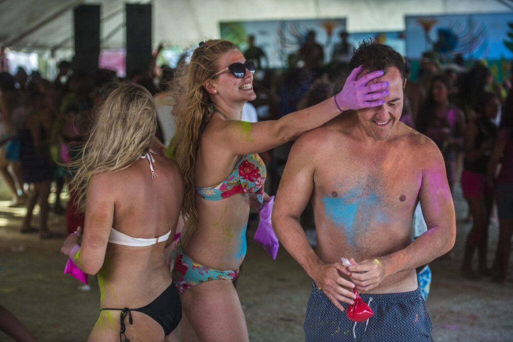 It's paint and powder at Caye Caulker's Lobster Fest. Image via Belize Tourism Board
