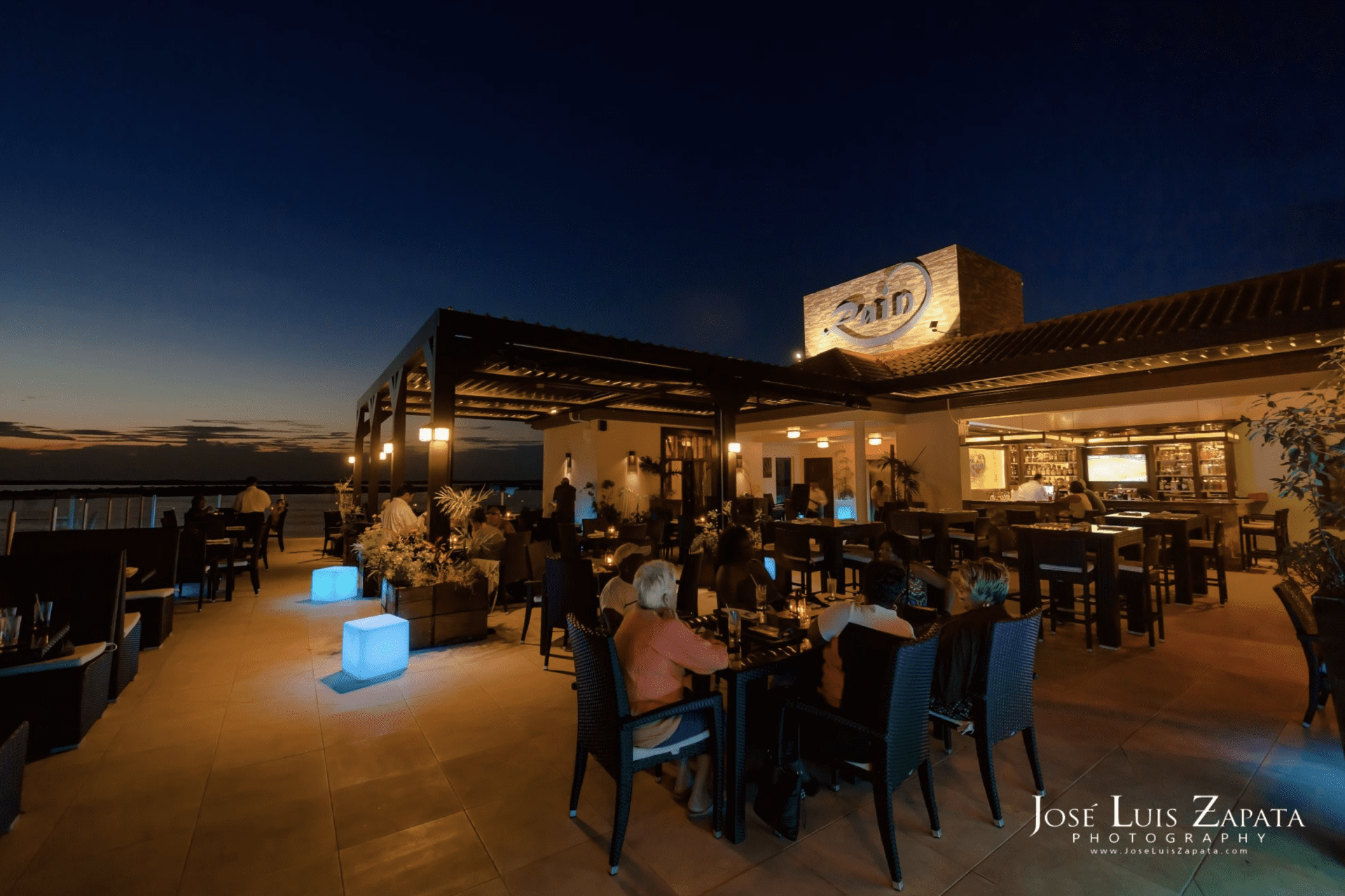 rain restaurant grand caribe rooftop bar dusk
